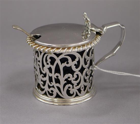 A Victorian pierced silver drum shaped mustard pot, London 1887, height 65mm.